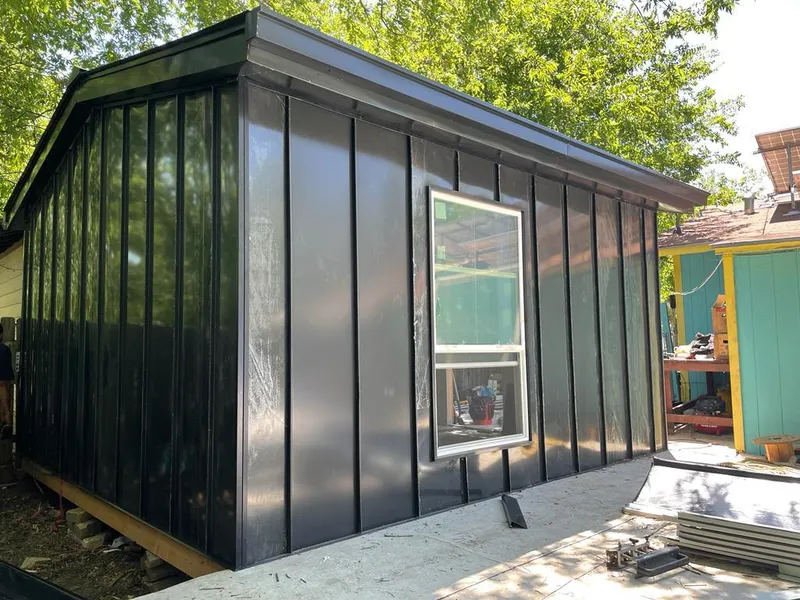 Black standing seam metal wall panels for Metal Roof Installation in Isanti